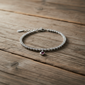 Pulsera con circonitas y colgante corazón